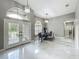 Foyer featuring modern lighting, and a view of the formal dining room at 704 Forest View Ct, Winter Springs, FL 32708
