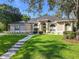 Charming single-story home featuring a beautifully landscaped front yard at 704 Forest View Ct, Winter Springs, FL 32708