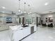 Modern open-concept kitchen with a large island, sleek cabinetry, and high-end finishes, perfect for entertaining and everyday living at 704 Forest View Ct, Winter Springs, FL 32708