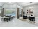 Bright and airy living room with modern lighting, stylish furniture, and a view of the pool at 704 Forest View Ct, Winter Springs, FL 32708