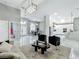 Open floor plan living room with view of modern kitchen and entryway with double doors at 704 Forest View Ct, Winter Springs, FL 32708