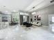 Bright and airy living room with tile floors, modern furniture, and large windows at 704 Forest View Ct, Winter Springs, FL 32708