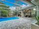 The screened in pool provides a relaxing outdoor oasis with a spacious covered patio area at 704 Forest View Ct, Winter Springs, FL 32708