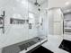 Elegant bathroom with a large walk-in shower, marble accents, and black hardware at 704 Forest View Ct, Winter Springs, FL 32708