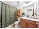 Clean bathroom featuring tiled floors, vanity with a sink and wooden storage cabinet at 8164 Wood Sage Dr, Winter Garden, FL 34787