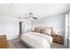 Inviting bedroom with neutral decor, ceiling fan, and natural light at 8164 Wood Sage Dr, Winter Garden, FL 34787