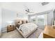 Serene bedroom with plush bed, neutral tones, and ample natural light at 8164 Wood Sage Dr, Winter Garden, FL 34787