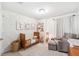 Lovely Bedroom with -themed art, comfortable chair, and stylish floor lamp at 8164 Wood Sage Dr, Winter Garden, FL 34787