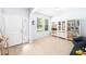 Bright foyer with wood-look flooring, white trim, and ample natural light at 8164 Wood Sage Dr, Winter Garden, FL 34787