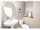 Stylish half bathroom featuring a pedestal sink and decorative accents at 8164 Wood Sage Dr, Winter Garden, FL 34787