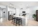 Modern kitchen features white cabinets, stainless steel appliances, and a spacious island at 8164 Wood Sage Dr, Winter Garden, FL 34787