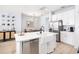 Modern kitchen with white cabinets, stainless appliances, and a large kitchen island at 8164 Wood Sage Dr, Winter Garden, FL 34787