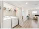 Laundry room with washer, dryer, and extra storage space at 8164 Wood Sage Dr, Winter Garden, FL 34787