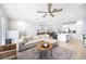 Cozy living room with hardwood floors, a comfortable sofa, and open layout at 8164 Wood Sage Dr, Winter Garden, FL 34787