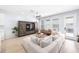 Spacious living room with natural light, stylish seating, and a cozy atmosphere at 8164 Wood Sage Dr, Winter Garden, FL 34787