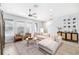 Open living space with wood floors, a comfortable sofa, and natural light at 8164 Wood Sage Dr, Winter Garden, FL 34787