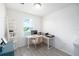 Bright office space with a window view and minimalist decor at 8164 Wood Sage Dr, Winter Garden, FL 34787