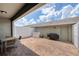 Large brick patio with privacy fence, barbecue grill, and stylish string lights at 8164 Wood Sage Dr, Winter Garden, FL 34787