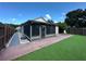 Beautiful backyard with screened-in patio, shed, and artificial grass at 8258 Golden Chickasaw Cir, Orlando, FL 32825