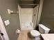 Bathroom featuring a walk-in shower, toilet, and towel rack at 8258 Golden Chickasaw Cir, Orlando, FL 32825