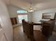 View of a bonus room with built in desks, shelving, and tile flooring at 8258 Golden Chickasaw Cir, Orlando, FL 32825