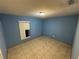 This bedroom features tile flooring, a window, and neutral colored walls at 8258 Golden Chickasaw Cir, Orlando, FL 32825