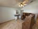This bonus room features two desks, neutral walls, and tile flooring at 8258 Golden Chickasaw Cir, Orlando, FL 32825