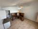 View of the bonus room with two desks, neutral walls, and tile flooring at 8258 Golden Chickasaw Cir, Orlando, FL 32825