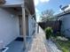 Welcoming home exterior with brick pathway and manicured landscaping at 8258 Golden Chickasaw Cir, Orlando, FL 32825
