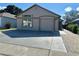 Charming single-story home with a well-maintained lawn, a two-car garage, and a welcoming entrance at 8258 Golden Chickasaw Cir, Orlando, FL 32825