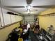 Garage with ceiling fan, door, and shelves at 8258 Golden Chickasaw Cir, Orlando, FL 32825