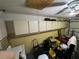 Garage with cabinets, and an open garage door at 8258 Golden Chickasaw Cir, Orlando, FL 32825