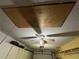 Spacious garage with ceiling fan and storage access at 8258 Golden Chickasaw Cir, Orlando, FL 32825