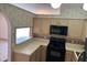 Cozy kitchen area featuring updated appliances, ample countertop space, and natural light from the overhead lighting at 8258 Golden Chickasaw Cir, Orlando, FL 32825