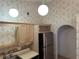 Charming kitchen offering stainless steel refrigerator, and light cabinetry with plenty of storage and natural light at 8258 Golden Chickasaw Cir, Orlando, FL 32825