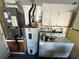 This is a laundry room with appliances, and storage space at 8258 Golden Chickasaw Cir, Orlando, FL 32825