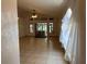 Spacious living area with tile floors, access to an outdoor patio, and neutral walls ready for your personal touch at 8258 Golden Chickasaw Cir, Orlando, FL 32825