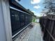 Relaxing screened-in patio with view of the pond at 8258 Golden Chickasaw Cir, Orlando, FL 32825