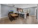 Spacious kitchen features stainless steel appliances, a center island with barstool seating, and ample countertop space at 8968 Hildreth Ave, Orlando, FL 32832