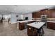 Modern kitchen with stainless steel appliances, a large island, and open layout, perfect for entertaining guests at 8968 Hildreth Ave, Orlando, FL 32832