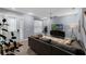 Comfortable living room featuring a sleek sofa, modern decor, and plenty of natural light from the front door at 8968 Hildreth Ave, Orlando, FL 32832