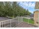 Private balcony overlooks a lush backyard with a swimming pool and mature trees at 9031 Stonebury Way, Orlando, FL 32832