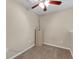 Simple carpeted room with a ceiling fan and a file cabinet at 9031 Stonebury Way, Orlando, FL 32832