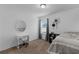 Well-lit bedroom with carpet, desk, and a large window at 9031 Stonebury Way, Orlando, FL 32832