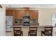 Modern kitchen featuring a granite countertop bar, stainless steel appliances and eat in counter at 9031 Stonebury Way, Orlando, FL 32832