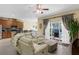 Inviting living room connected to kitchen with access to the pool patio at 9031 Stonebury Way, Orlando, FL 32832