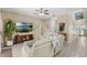 Cozy living room featuring stylish tile floors, comfortable seating, and neutral walls at 9031 Stonebury Way, Orlando, FL 32832