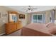 Comfortable main bedroom features balcony access, a cozy bed, and a classic dresser at 9031 Stonebury Way, Orlando, FL 32832