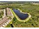 Aerial view of the community including sidewalks for walking or jogging around the peaceful lake at 9997 Town Lake Dr, Orlando, FL 32832
