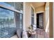 Charming balcony setting with comfortable chairs and a serene outdoor view at 9997 Town Lake Dr, Orlando, FL 32832